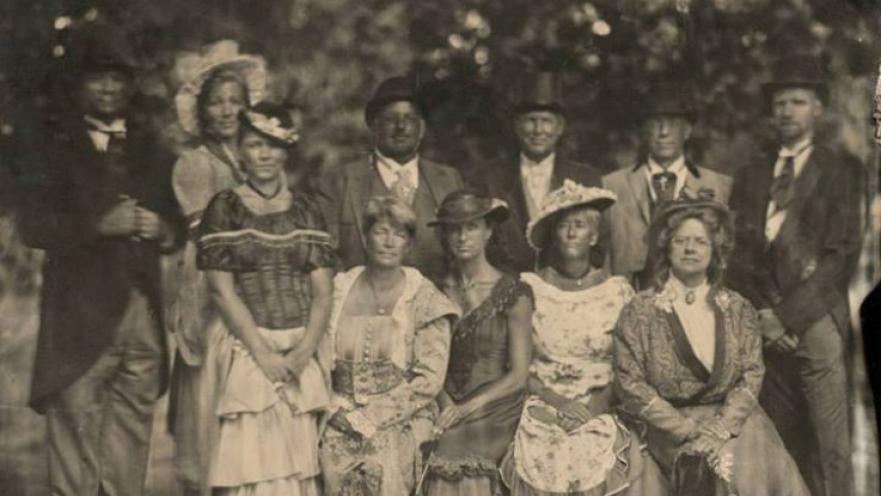 Old photograph of with people wearing period-appropriate clothing (Victorian).
