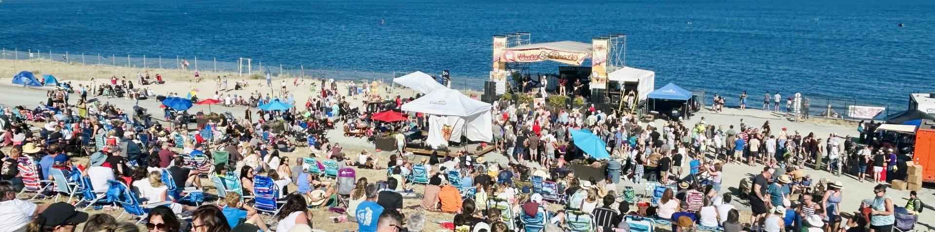 view of the crowd, stage and ocean at Eats & Beats 2025