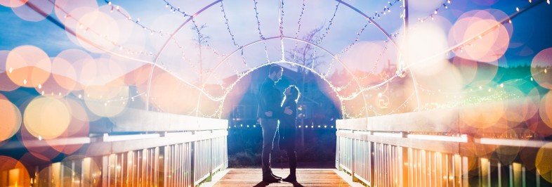 light tunnel on the bridge in meadow park with couple