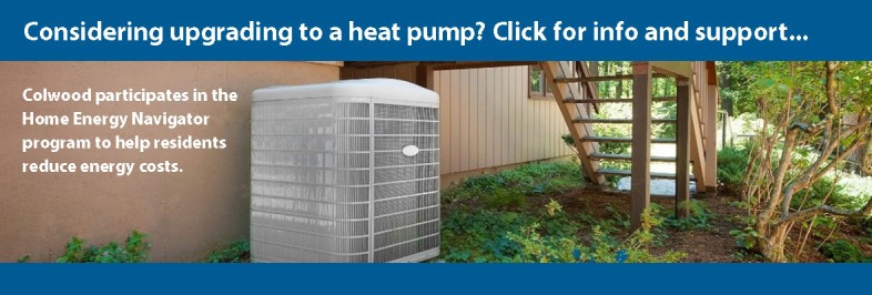 image of a heat pump next to a house