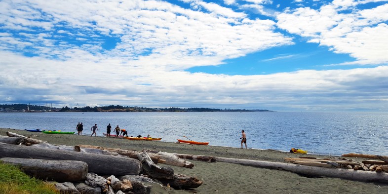 people on the lagoon beach in colwood