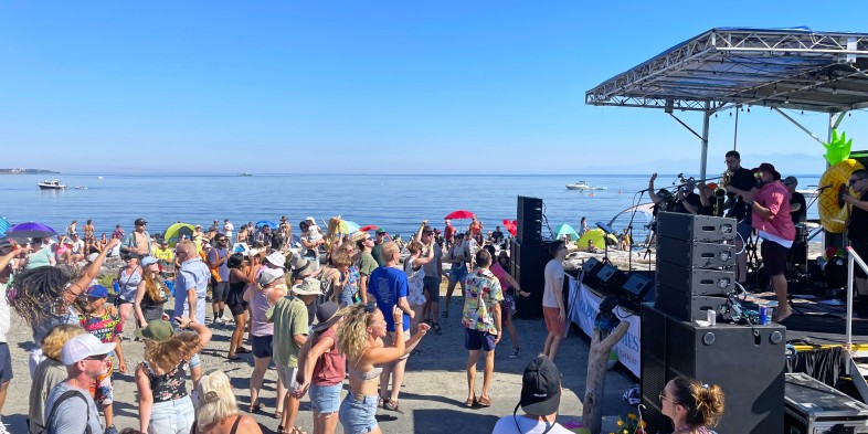 people dancing by the ocean at Eats & Beats in Colwood