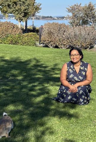 dr. swathi smiling on the lawn at the beach park