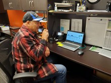 volunteer amateur radio operator at desk 