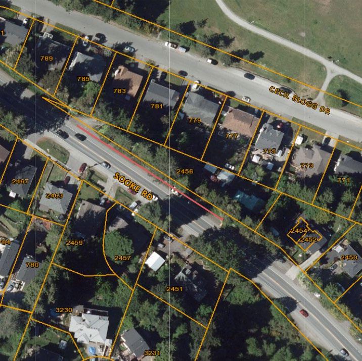 Aerial map showing a highlighted section of Sooke Road bordered by residential lots and Cecil Blogg Drive. The highlighted area is outlined in red, indicating the specific section of Sooke Road in focus.